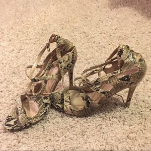 Scrappy snakeskin heels